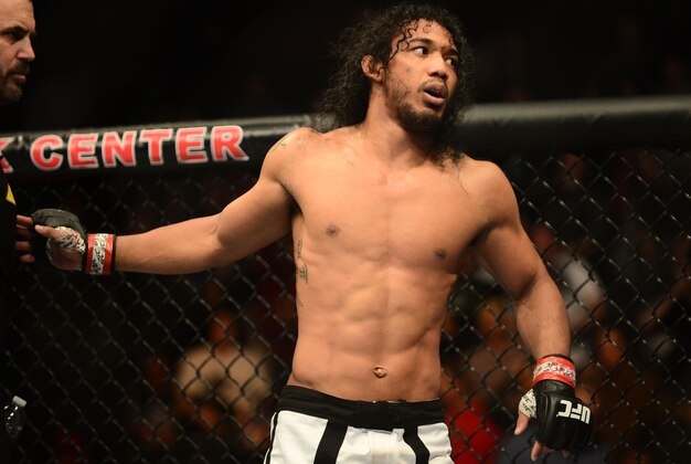 Feb 14, 2015; Broomfield, CO, USA; Benson Henderson (red) celebrates his win over Brandon Thatch (not pictured) following the welterweight bout at the UFC Fight Night at the 1stBANK Center. Mandatory Credit: Ron Chenoy-USA TODAY Sports
