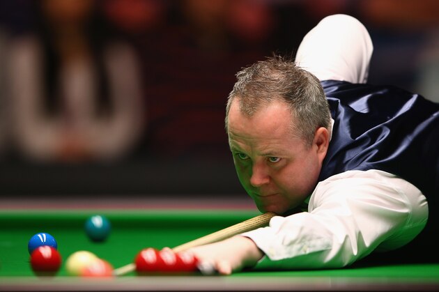 LONDON, ENGLAND - JANUARY 14:  John Higgins of Scotland plays a shot during his first round match against Mark Allen of  Northern Ireland on Day Four of the 2015 Dafabet Masters at Alexandra Palace on January 14, 2015 in London, England.  (Photo by Ian Walton/Getty Images)