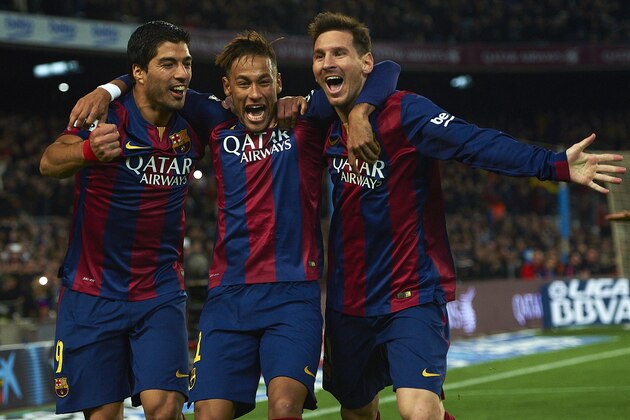 FC Barcelona's Lionel Messi, from Argentine, right, Neymar, from Brazil, center, and Luis Suarez, from Uruguay, celebrate after scoring against Atletico Madrid during a Spanish La Liga soccer match at the Camp Nou stadium in Barcelona, Spain, Sunday, Jan. 11, 2015. (AP Photo/Siu Wu)