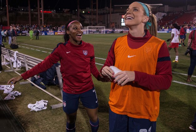 Jan 31, 2014; Frisco, TX, USA; USA defender Crystal Dunn (7) and midfielder Julie Johnston (22) celebrate the 1-0 win over Canada at Toyota Stadium. Mandatory Credit: Jerome Miron-USA TODAY Sports