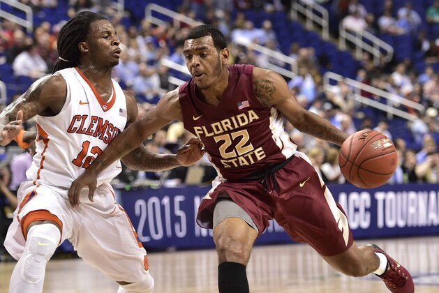 Mar 11, 2015; Greensboro, NC, USA; Florida State Seminoles guard Xavier Rathan-Mayes (22) dribbles as Clemson Tigers guard Rod Hall (12) defends in the first half in the second round at Greensboro Coliseum. Mandatory Credit: Bob Donnan-USA TODAY Sports