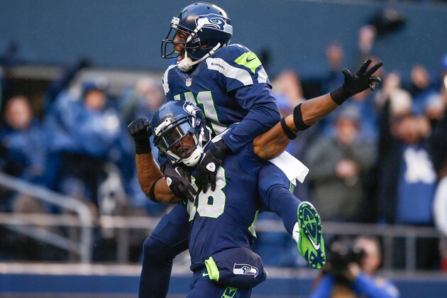 SEATTLE, WA - NOVEMBER 17:  Cornerback Walter Thurmond #28 of the Seattle Seahawks is congratulated by defensive back Byron Maxwell #41 after returning an interception for a touchdown against the Minnesota Vikings at CenturyLink Field on November 17, 2013 in Seattle, Washington. The Seahawks defeated the Vikings 41-20.  (Photo by Otto Greule Jr/Getty Images)