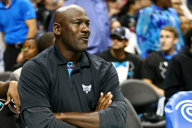 CHARLOTTE, NC - OCTOBER 29:  Michael Jordan, owner of the Charlotte Hornets, watches on during their game against the Milwaukee Bucks at Time Warner Cable Arena on October 29, 2014 in Charlotte, North Carolina.  The Charlotte Hornets defeated the Milwaukee Bucks 108-106 in overtime. NOTE TO USER: User expressly acknowledges and agrees that, by downloading and or using this photograph, User is consenting to the terms and conditions of the Getty Images License Agreement.  (Photo by Streeter Lecka/Getty Images)