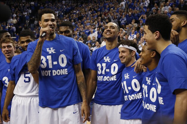 FILE - In this March 7, 2015, file photo, Kentucky's Willie Cauley-Stein, third from left, address the crowd during a ceremony marking the teams undefeated season after an NCAA college basketball game against Florida in Lexington, Ky. Kentucky won 67-50. Kentucky coach John Calipari seems unfazed by the prospect of a conference tournament loss, as long as it's the last one his team suffers in pursuit of national championship No. 9.(AP Photo/James Crisp, File)