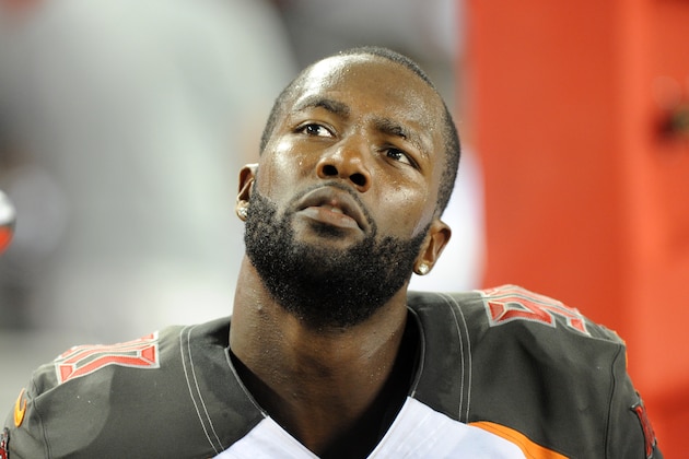 TAMPA, FL - AUGUST 16:  Defensive end Michael Johnson #90 of the Tampa Bay Buccaneers at Raymond James Stadium during a preseason game on August 16, 2014 in Tampa, Florida. (Photo by Cliff McBride/Getty Images)