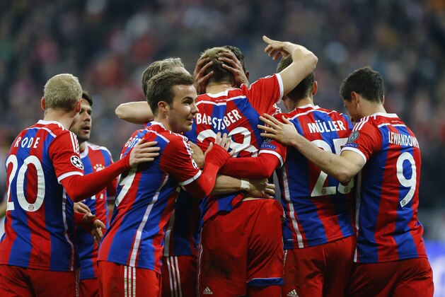 Bayern players celebrate scoring 5-0 during the Champions League round of 16 second leg soccer match between Bayern Munich and Shakhtar Donetsk Wednesday, March 11, 2015 in Munich, southern Germany. (AP Photo/Matthias Schrader)