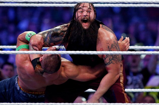 John Cena, left, and Bray Wyatt, right, compete during Wrestlemania XXX at the Mercedes-Benz Super Dome in New Orleans on Sunday, April 6, 2014. (Jonathan Bachman/AP Images for WWE)
