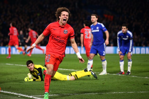 LONDON, ENGLAND - MARCH 11:  David Luiz of PSG celebrates after teammate Thiago Silva of PSG scores a goal to level the scores at 2-2 during the UEFA Champions League Round of 16, second leg match between Chelsea and Paris Saint-Germain at Stamford Bridge on March 11, 2015 in London, England.  (Photo by Paul Gilham/Getty Images)
