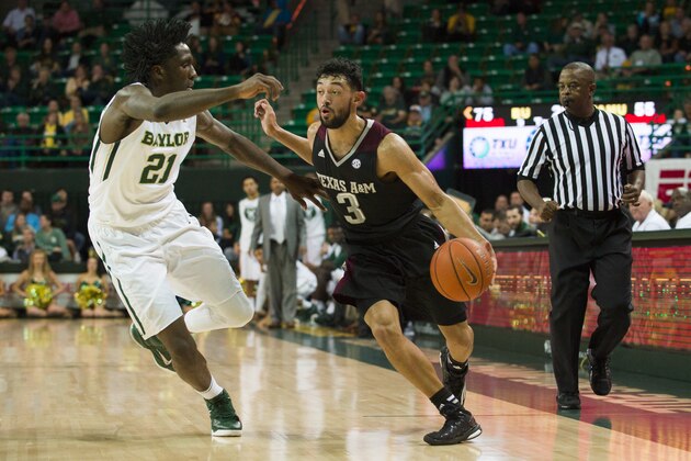 WACO, TX - DECEMBER 9:  Alex Robinson #3 of the Texas A&M Aggies brings the ball upcourt against Taurean Prince #21 of the Baylor Bears on December 9, 2014 at the Ferrell Center in Waco, Texas.  (Photo by Cooper Neill/Getty Images)