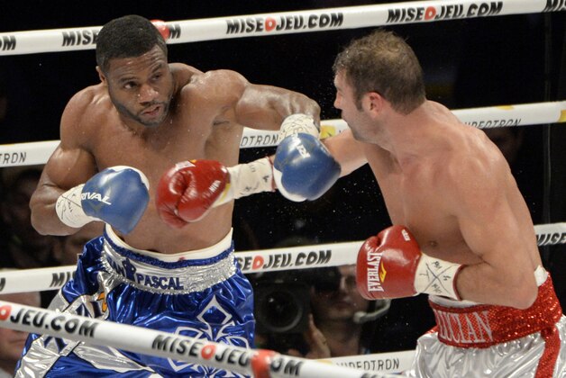 Jan 18, 2014; Montreal, Quebec, Canada; Jean Pascal (blue  trunks) and Lucian Bute (white and red trunks) box during their NABF light heavyweight title bout at  the Bell Centre. Mandatory Credit: Eric Bolte-USA TODAY Sports