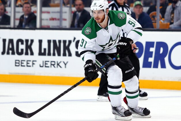Dallas Stars' Tyler Seguin carries the puck against the Boston Bruins during the third period of the Dallas Stars 5-3 win over the Boston Bruins in an NHL hockey game in Boston Tuesday, Feb. 10, 2015. (AP Photo/Winslow Townson)