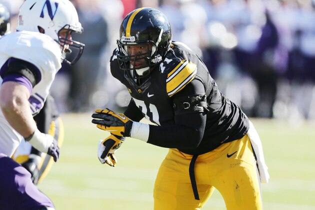 Iowa defensive lineman Carl Davis (71) runs up field during the second half of an NCAA college football game against Northwestern, Saturday, Nov. 1, 2014, in Iowa City, Iowa. (AP Photo/Justin Hayworth)