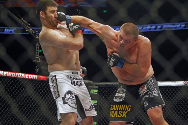 Josh Copeland, right, lands a punch against Ruslan Magomedov in a heavyweight mixed martial arts bout during UFC Fight Night in Austin, Texas, Saturday, Nov. 22, 2014. (AP Photo/Michael Thomas)