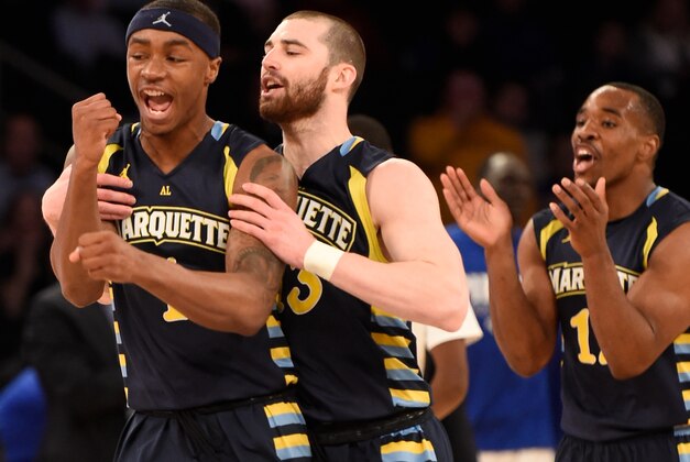 Mar 11, 2015; New  York, NY, USA; Marquette Golden Eagles guard Duane Wilson (1) and guard Matt Carlino (13) celebrate a three point basket against the Seton Hall Pirates during the first round of the Big East Tournament at Madison Square Garden. Mandatory Credit: Robert Deutsch-USA TODAY Sports