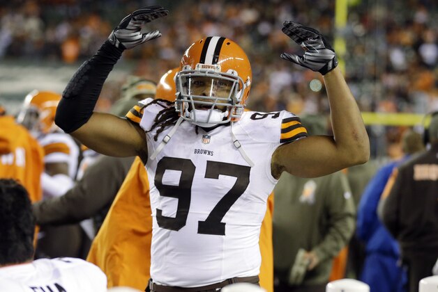 Cleveland Browns outside linebacker Jabaal Sheard (97) celebrates after a 24-3 win over the Cleveland Browns in an NFL football game Thursday, Nov. 6, 2014, in Cincinnati. (AP Photo/Michael Conroy)