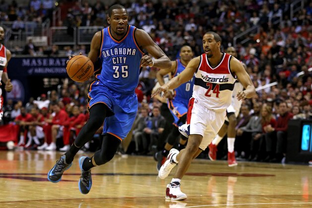 WASHINGTON, DC - JANUARY 21: Kevin Durant #35 of the Oklahoma City Thunder dribbles past Andre Miller #24 of the Washington Wizards in the first half at Verizon Center on January 21, 2015 in Washington, DC. NOTE TO USER: User expressly acknowledges and agrees that, by downloading and or using this photograph, User is consenting to the terms and conditions of the Getty Images License Agreement. (Photo by Patrick Smith/Getty Images)