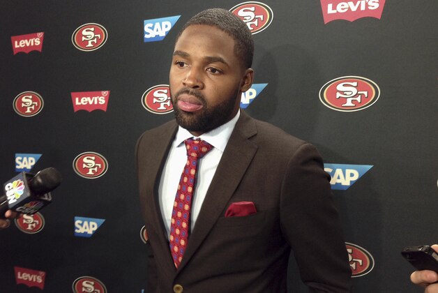Wide receiver Torrey Smith speaks to the media about joining the San Francisco 49ers at the team's NFL football facility in Santa Clara, Calif., Wednesday, March 11, 2015. The free agent wide receiver finalized his new five-year contract with the 49ers on Wednesday, filling a void left by Michael Crabtree’s expected departure and reuniting him with a couple of former teammates, wide receiver Anquan Boldin and tight end Vernon Davis. (AP Photo/Janie McCauley)