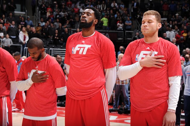 LOS ANGELES, CA - JANUARY 22: Chris Paul #3, DeAndre Jordan #6, and Blake Griffin #32 of the Los Angeles Clippers stand for the national anthem before a game against the Brooklyn Nets at STAPLES Center on January 22, 2015 in Los Angeles, California. NOTE TO USER: User expressly acknowledges and agrees that, by downloading and/or using this Photograph, user is consenting to the terms and conditions of the Getty Images License Agreement. Mandatory Copyright Notice: Copyright 2015 NBAE (Photo by Andrew D. Bernstein/NBAE via Getty Images)