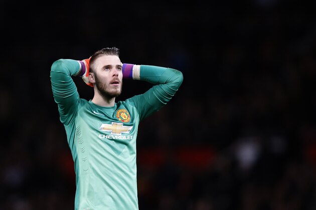 Manchester United’s goalkeeper David De Gea looks up at the end of  the English FA Cup quarterfinal soccer match between Manchester United and Arsenal at Old Trafford Stadium, Manchester, England, Monday, March 9, 2015. Arsenal won the game 2-1.(AP Photo/Jon Super)