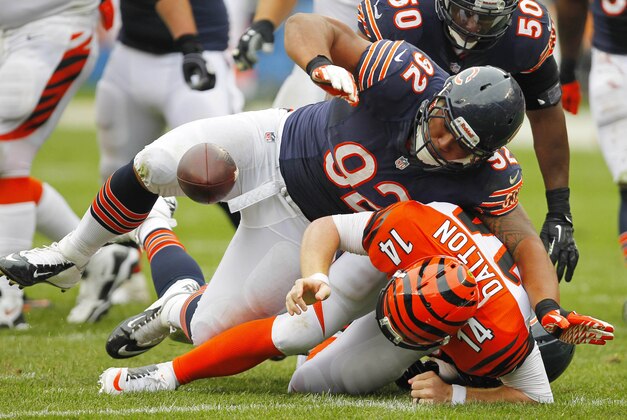 Sep 8, 2013; Chicago, IL, USA; Chicago Bears defensive tackle Stephen Paea (92) sacks Cincinnati Bengals quarterback Andy Dalton (14) during the second half at Soldier Field. Chicago won 24-21. Mandatory Credit: Dennis Wierzbicki-USA TODAY Sports