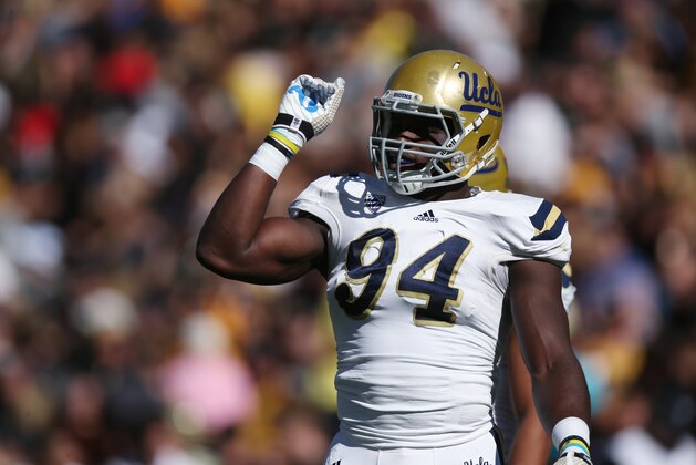 UCLA defensive lineman Owamagbe Odighizuwa waits to face Colorado in the first quarter of an NCAA football game in Boulder, Colo., on Saturday, Oct. 25, 2014. (AP Photo/David Zalubowski)