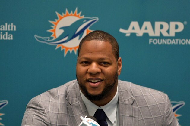 Mar 11, 2015; Davie, FL, USA; Miami Dolphins defensive tackle Ndamukong Suh smiles while answering questions from reports at Doctors Hospital Training Facility. Mandatory Credit: Steve Mitchell-USA TODAY Sports