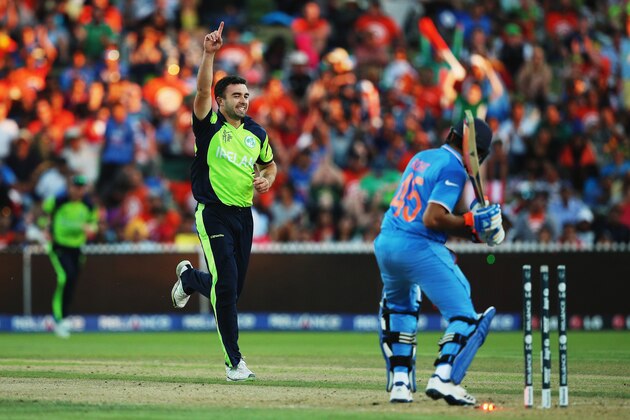 HAMILTON, NEW ZEALAND - MARCH 10:  Stuart Thompson of Ireland celebrates after bowling Rohit Sharma of India out during the 2015 ICC Cricket World Cup match between Ireland and India at Seddon Park on March 10, 2015 in Hamilton, New Zealand.  (Photo by Hannah Peters/Getty Images)