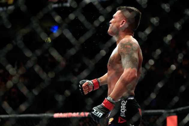 LAS VEGAS, NV - DECEMBER 06:  Anthony Pettis celebrates after defeating Gilbert Menendez in their lightweight title fight during the UFC 181 event at the Mandalay Bay Events Center on December 6, 2014 in Las Vegas, Nevada.  (Photo by Alex Trautwig/Getty Images)