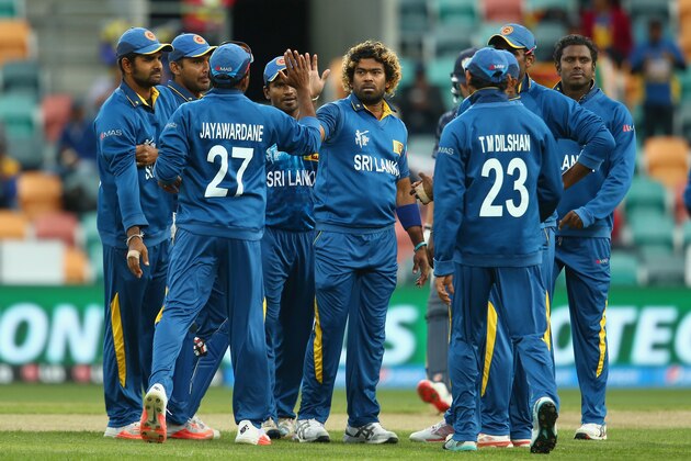 HOBART, AUSTRALIA - MARCH 11:  Lasith Malinga of Sri Lanka celebrates with his team mates after taking the wicket of Kyle Coetzer of Sri Lanka during the 2015 Cricket World Cup match between Sri Lanka and Scotland at Bellerive Oval on March 11, 2015 in Hobart, Australia.  (Photo by Mark Kolbe/Getty Images)