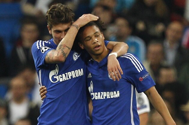 Schalke's Leroy Sane, right, celebrates with team mates scoring his side's 3rd goal during a Champions League soccer match round of 16 second leg, between Real Madrid and Schalke 04 at Santiago Bernabeu stadium, in Madrid, Spain, Tuesday, March 10, 2015. (AP Photo/Andres Kudacki)