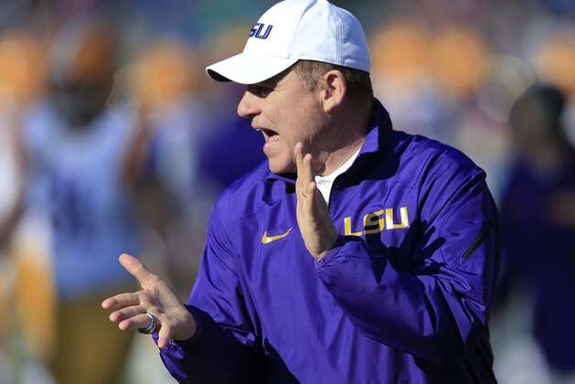 LSU head coach Les Miles watches his players warm up before the Music City Bowl NCAA college football game against Notre Dame, Tuesday, Dec. 30, 2014, in Nashville, Tenn. (AP Photo/Mark Humphrey)