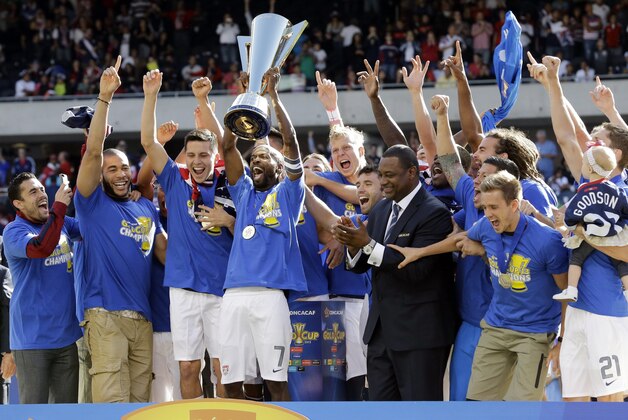 United States players celebrate with the trophy after United States defeated Panama 1-0 during the CONCACAF Gold Cup final match at Soldier Field on Sunday, July 28, 2013, in Chicago. (AP Photo/Nam Y. Huh)