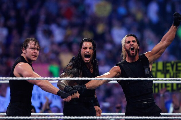 The Shield reacts after their win during Wrestlemania XXX at the Mercedes-Benz Super Dome in New Orleans on Sunday, April 6, 2014. (Jonathan Bachman/AP Images for WWE)