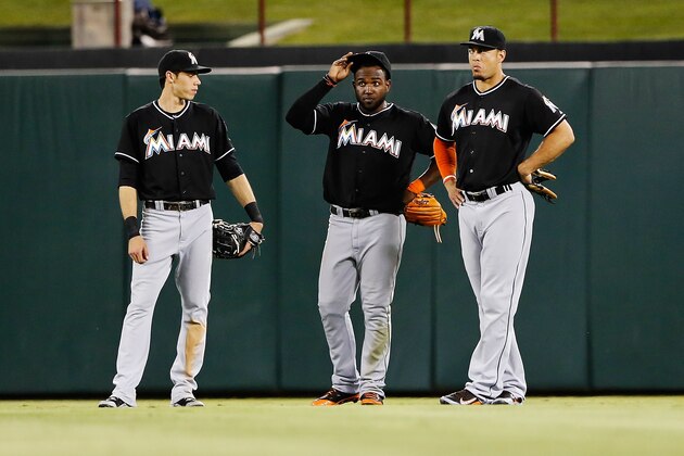 Jun 10, 2014; Arlington, TX, USA; Miami Marlins left fielder Christian Yelich (21) and center fielder Marcell Ozuna (13) and right fielder Giancarlo Stanton (27) during the game against the Texas Rangers at Globe Life Park in Arlington. Mandatory Credit: Kevin Jairaj-USA TODAY Sports