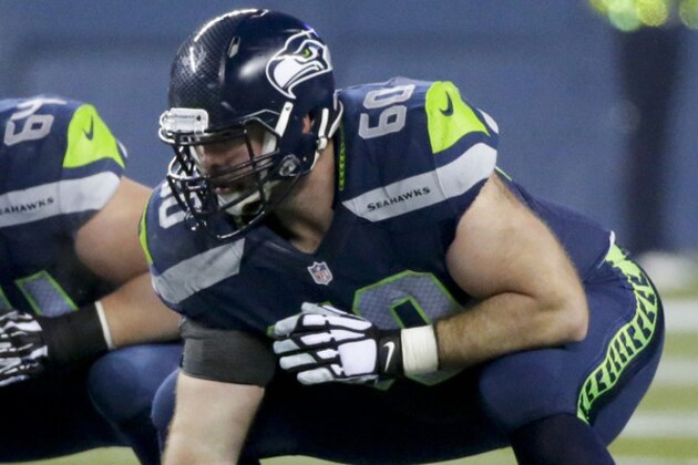 Seattle Seahawks center Max Unger prepares to snap the ball during the second half of an NFL divisional playoff football game against the Carolina Panthers in Seattle, Saturday, Jan. 10, 2015. (AP Photo/Ted S. Warren)