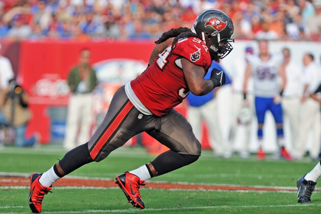 TAMPA, FL -  DECEMBER 8:  Defensive end Adrian Clayborn #94 of the Tampa Bay Buccaneers rushes the pocket against the Buffalo Bills   December 8, 2013 at Raymond James Stadium in Tampa, Florida.  (Photo by Al Messerschmidt/Getty Images)