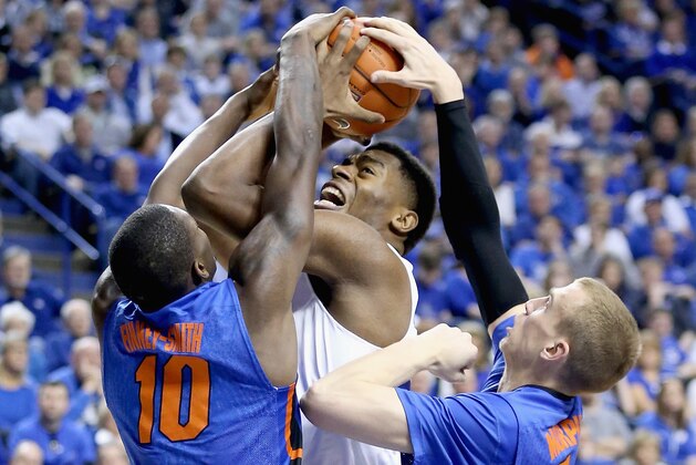 LEXINGTON, KY - MARCH 07:  Dakari Johnson #44 of the Kentucky Wildcats shoots the ball while defended by Dorian Finney-Smith #10 and Alex Murphy #5 of the Florida Gators during the game at Rupp Arena on March 7, 2015 in Lexington, Kentucky.  (Photo by Andy Lyons/Getty Images)