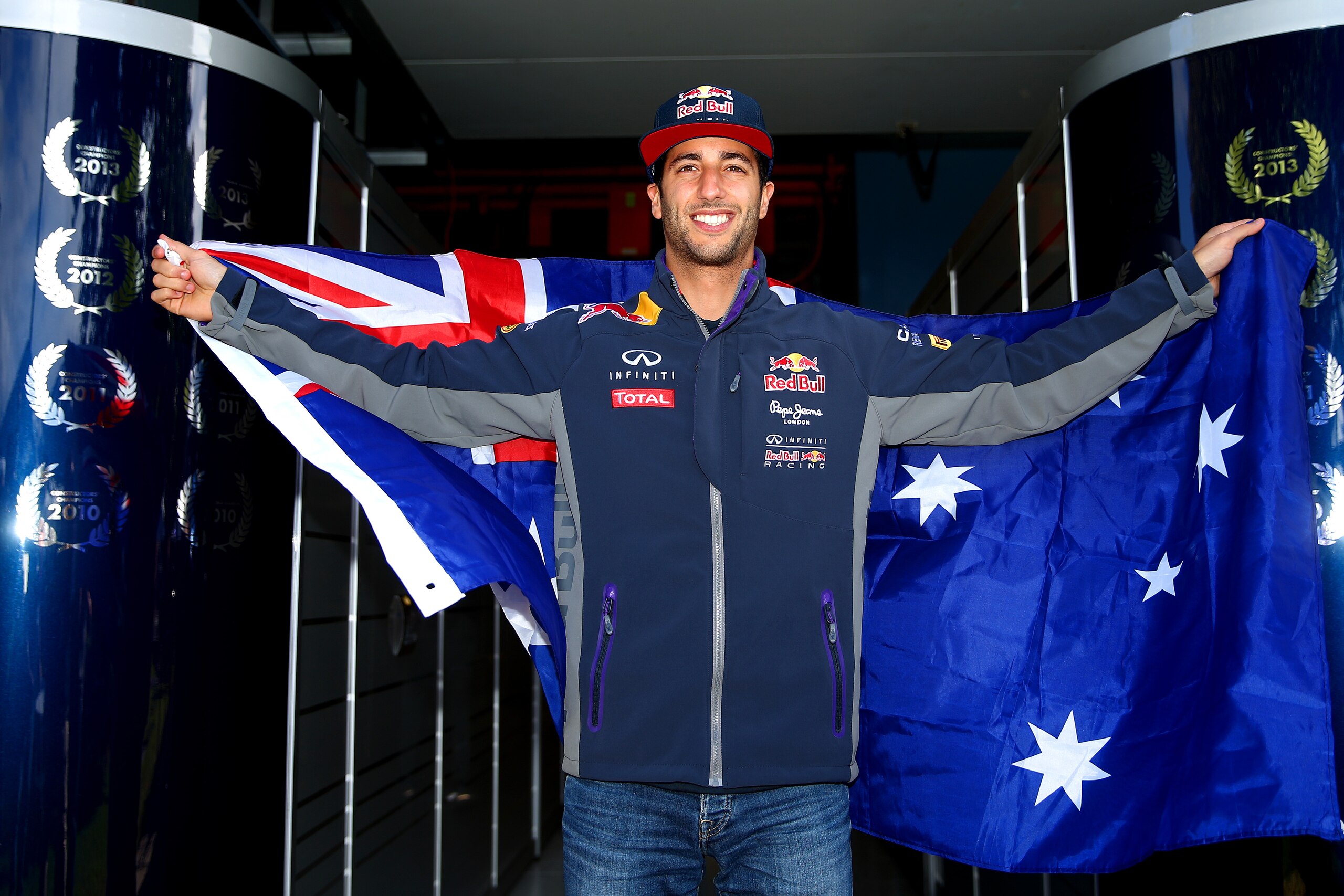 MELBOURNE, AUSTRALIA - MARCH 12: Daniel Ricciardo of Australia and Infiniti Red Bull Racing poses with the Australian national flag outside the team garage during previews to the Australian Formula One Grand Prix at Albert Park on March 12, 2015 in Melbourne, Australia. (Photo by Robert Cianflone/Getty Images) MELBOURNE, AUSTRALIA - MARCH 12: Daniel Ricciardo of Australia and Infiniti Red Bull Racing poses with the Australian national flag outside the team garage during previews to the Australian Formula One Grand Prix at Albert Park on March 12, 2015 in Melbourne, Australia. (Photo by Robert Cianflone/Getty Images)