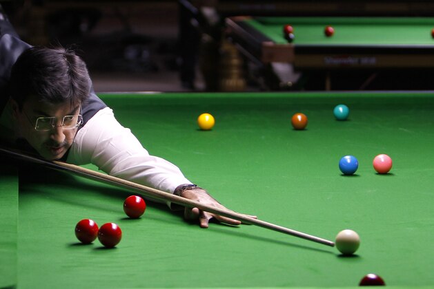 India's Yasin Merchant plays a shot during a round robin league match against England's Martin O'Donnell, unseen, at the International Billiards and Snooker Federation (IBSF) World Snooker Championship in Bangalore, India, Tuesday, Nov. 29, 2011. The six day event which started Monday have participants from 41 countries. (AP Photo/Aijaz Rahi)