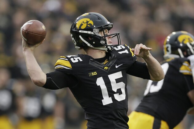 Iowa quarterback Jake Rudock throws a pass during the first half of an NCAA college football game against Wisconsin, Saturday, Nov. 22, 2014, in Iowa City, Iowa. (AP Photo/Charlie Neibergall)
