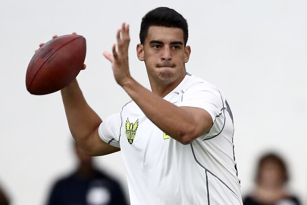 Oregon's Marcus Mariota throws during drills for NFL football scouts during Pro Day at the University of Oregon, Thursday, March 12, 2015, in Eugene, Ore. (AP Photo/Ryan Kang)