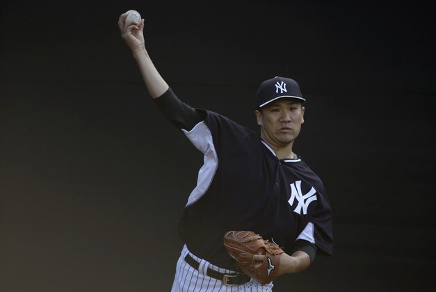 New York Yankees starting pitcher Masahiro Tanaka, of Japan, throws in the bullpen during a spring training baseball workout, Tuesday, March 9, 2015, in Tampa, Fla. (AP Photo/Lynne Sladky)