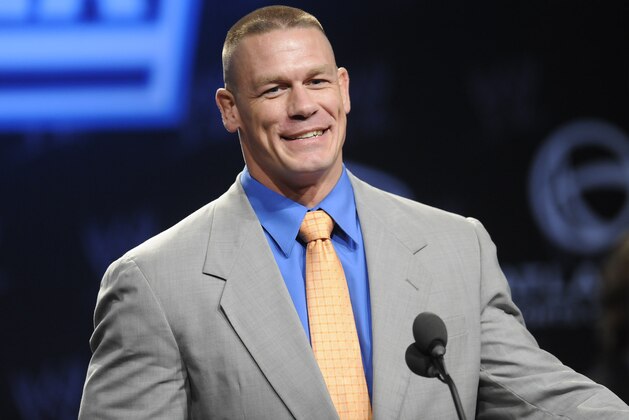 FILE - In this March 30, 2011 file photo, WWE star John Cena participates in a Wrestlemania XXVII news conference at the Hard Rock Cafe in Times Square in New York. The death of Trayvon Martin has led to a debate about whether wearing a hooded sweatshirt presents a negative image. Cena says he was bullied as a kid because he loved rap and wore hip-hop clothing in a town where it wasn't popular. That's when he started lifting weights to protect himself. Cena is headlining against Duane