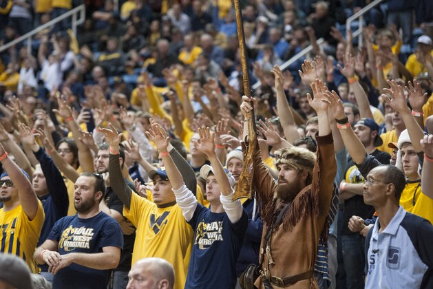 West Virginia Mountaineers mascot leads the student section during an NCAA college basketball game Wednesday, Feb. 5, 2014, in Morgantown, W.Va. West Virginia won 91-86 in overtime. (AP Photo/Andrew Ferguson)