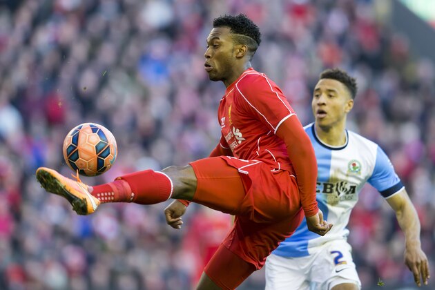 Liverpool's Daniel Sturridge, left, controls a ball as Blackburn's Adam Henley looks on during the English FA Cup quarter final soccer match between Liverpool and Blackburn at Anfield Stadium, Liverpool, England, Sunday March 8, 2015. (AP Photo/Jon Super)