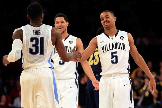 NEW YORK, NY - MARCH 12: Phil Booth #5 celebrates with Dylan Ennis #31 of the Villanova Wildcats against the Marquette Golden Eagles during a quarterfinal game of the Big East basketball tournament at Madison Square Garden on March 12, 2015 in New York City.  (Photo by Alex Trautwig/Getty Images)