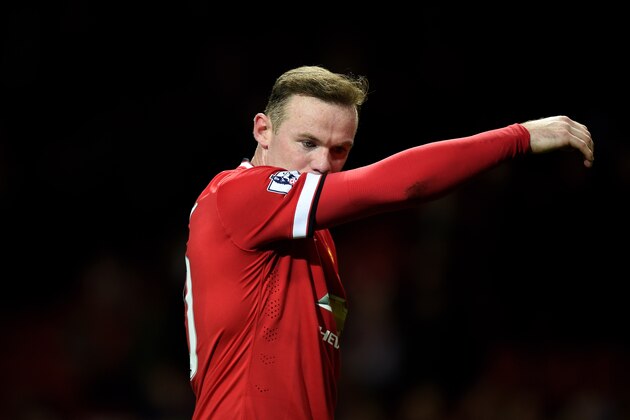 MANCHESTER, ENGLAND - MARCH 09:  A dejected Wayne Rooney of Manchester United walks off the pitch following his team's 2-1 defeat during the FA Cup Quarter Final match between Manchester United and Arsenal at Old Trafford on March 9, 2015 in Manchester, England.  (Photo by Michael Regan/Getty Images)
