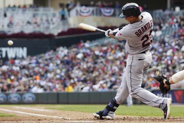 Cleveland Indians' Michael Brantley connects for an RBI-double during the third inning of a baseball game against the Minnesota Twins, Sunday, Sept. 21, 2014, in Minneapolis. Cleveland won 7-2. (AP Photo/Paul Battaglia)