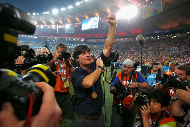 RIO DE JANEIRO, BRAZIL - JULY 13:  Head coach Joachim Loew of Germany celebrates after defeating Argentina 1-0 in extra time during the 2014 FIFA World Cup Brazil Final match between Germany and Argentina at Maracana on July 13, 2014 in Rio de Janeiro, Brazil.  (Photo by Clive Rose/Getty Images)