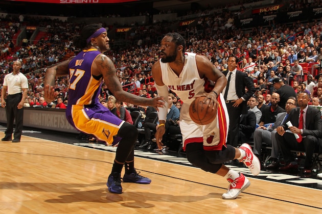 MIAMI, FL - MARCH 4:  Henry Walker #5 of the Miami Heat drives to the basket against Jordan Hill #27 of the Los Angeles Lakers on March 4, 2015 at American Airlines Arena in Miami, Florida.  NOTE TO USER: User expressly acknowledges and agrees that, by downloading and or using this Photograph, user is consenting to the terms and conditions of the Getty Images License Agreement. Mandatory Copyright Notice: Copyright 2015 NBAE (Photo by Issac Baldizon/NBAE via Getty Images)